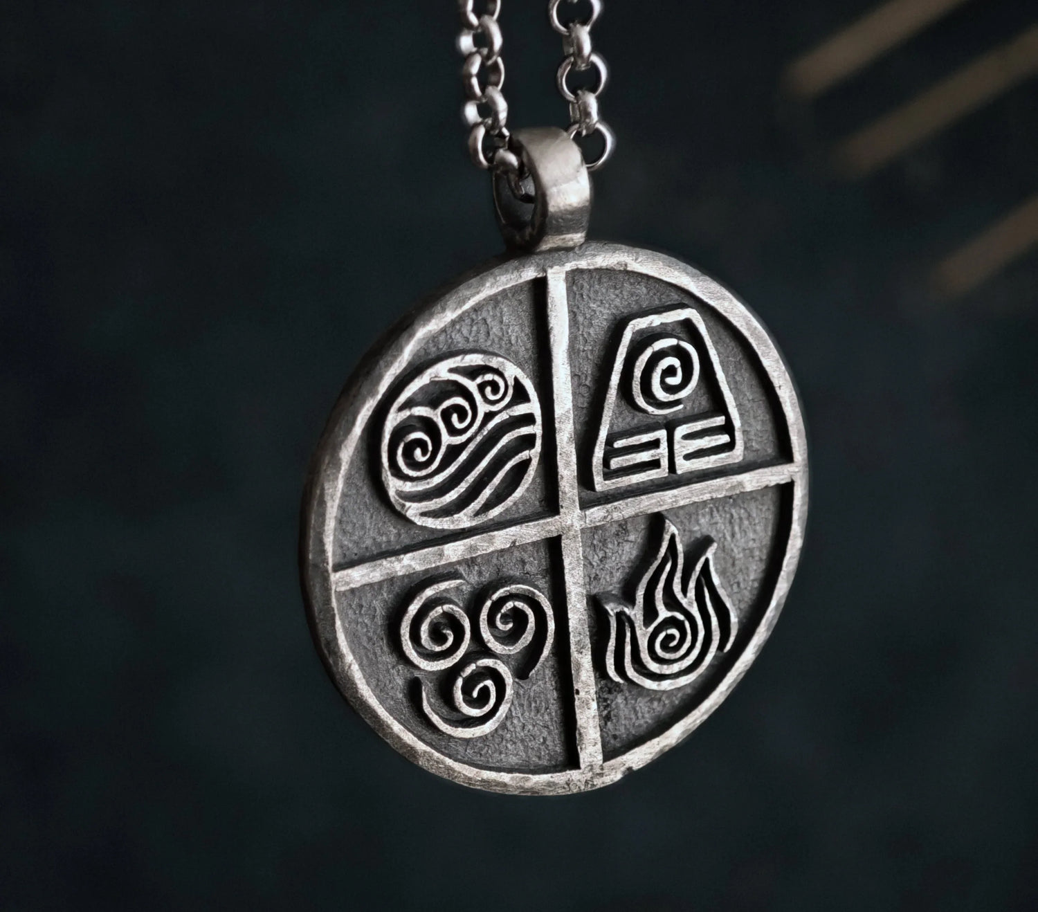 Silver Avatar: The Last Airbender necklace with water, earth, fire, and air symbols