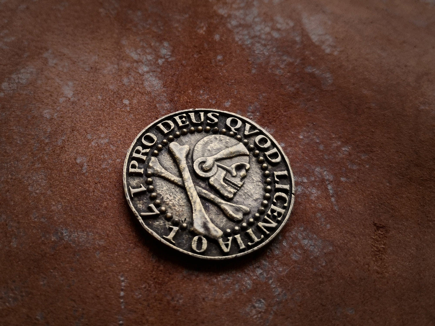 Brass Uncharted pirate coin necklace, double-sided with ship and skull, precise replica, includes chain.